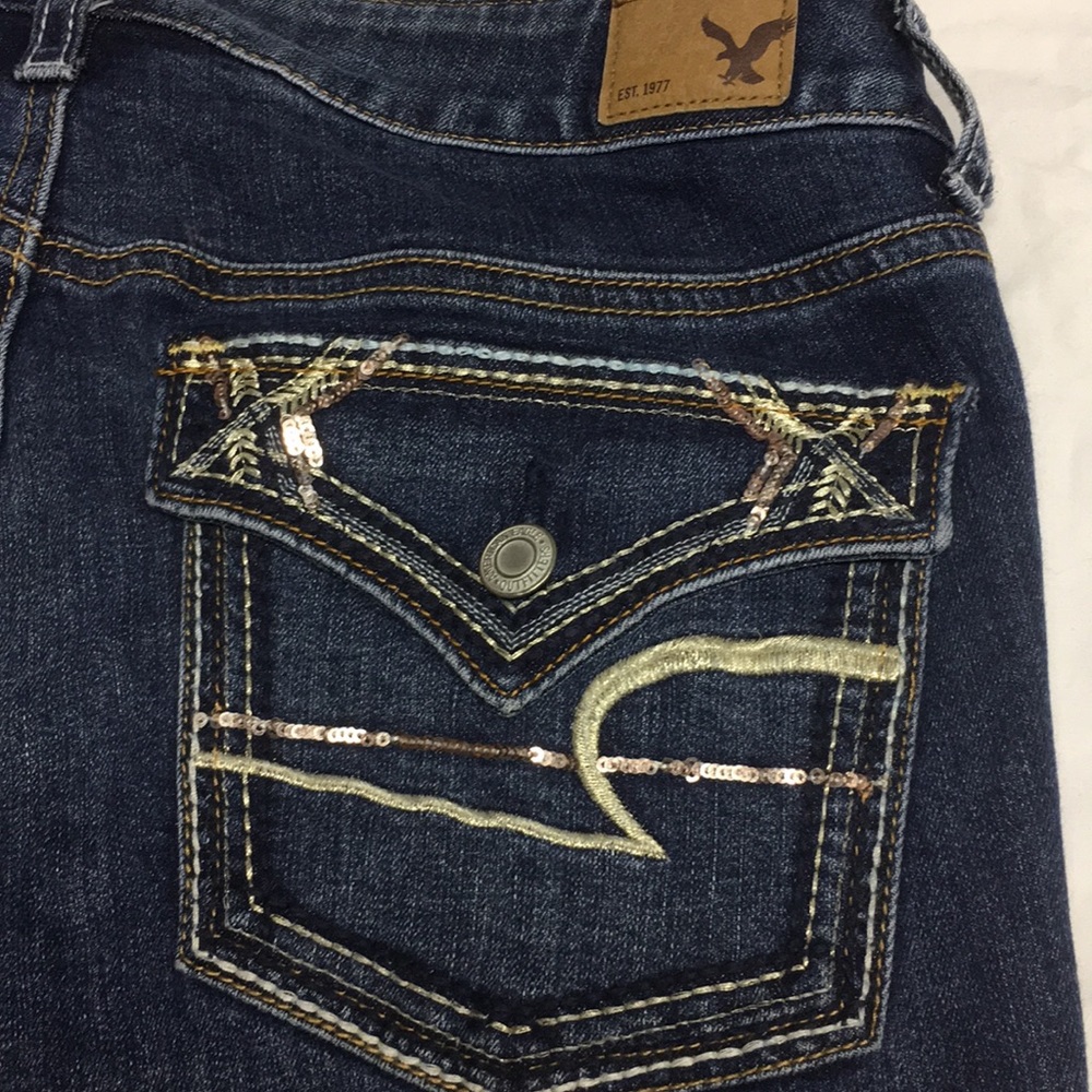 American Eagle destressed skinny flap pocket